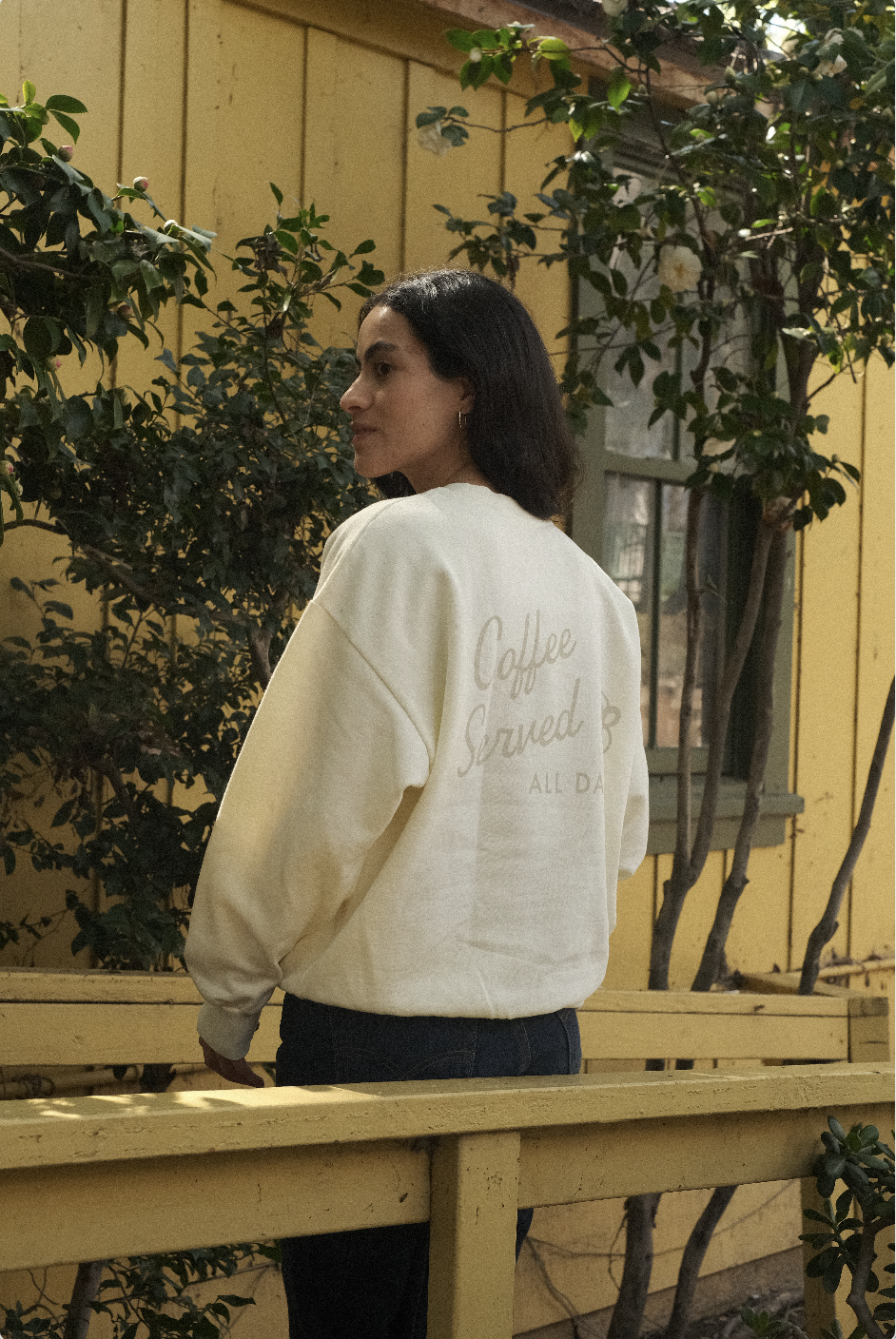 Image of woman wearing the crew neck sweatshirt.