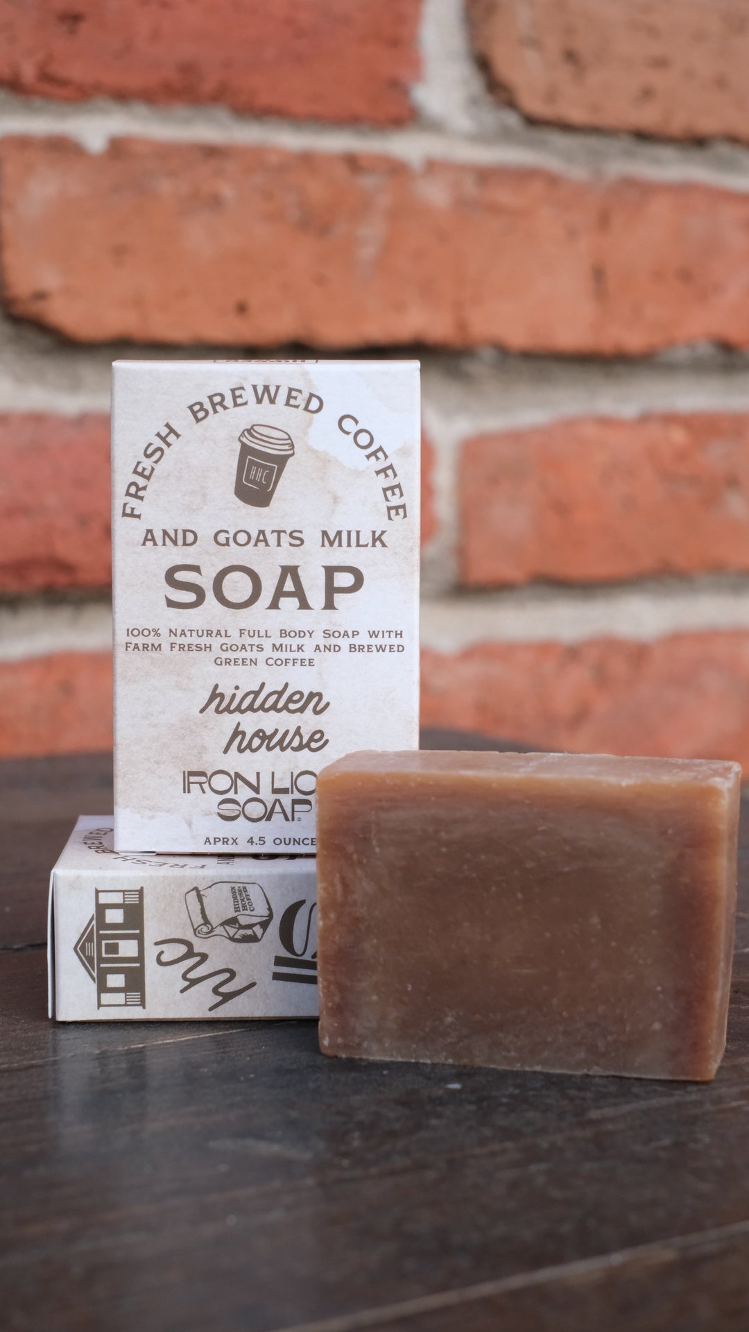Picture of bar of soap with the packaging that it comes in. The box reads "fresh brewed coffee and goats milk soap" 100% natural full body soap with farm fresh goats milk and brewed green coffee.