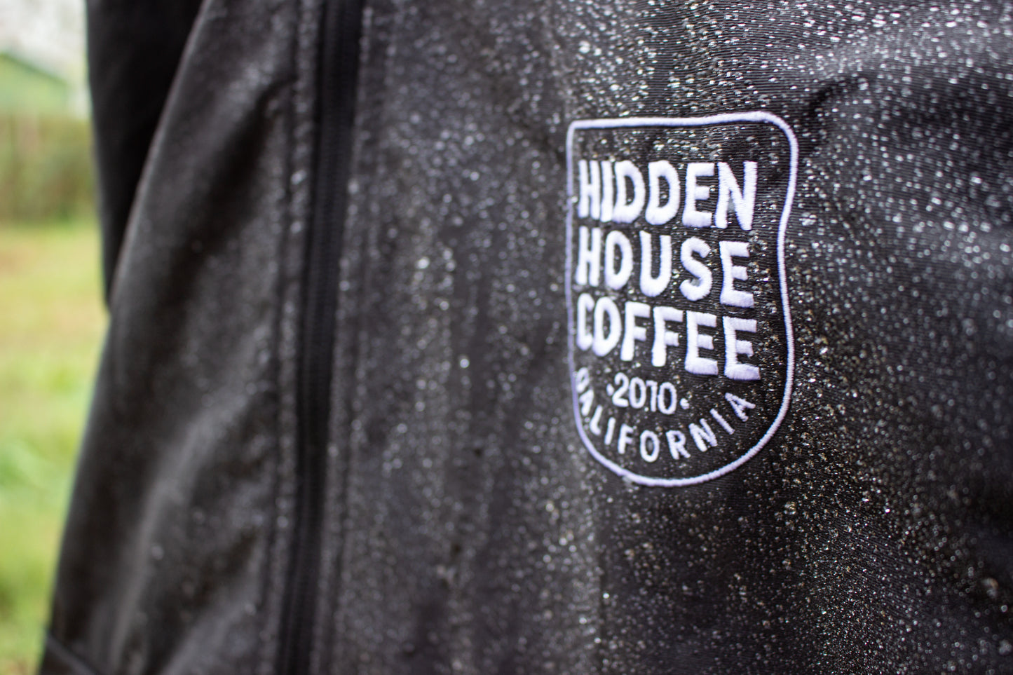 Image showing water repellency of jacket. Water is beaded on the material.