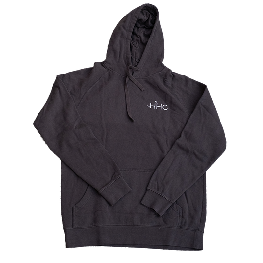 Image of front of black hoodie. HHC is incribed.